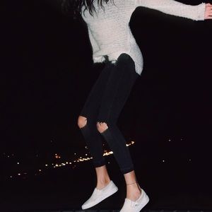 knee ripped black jeans